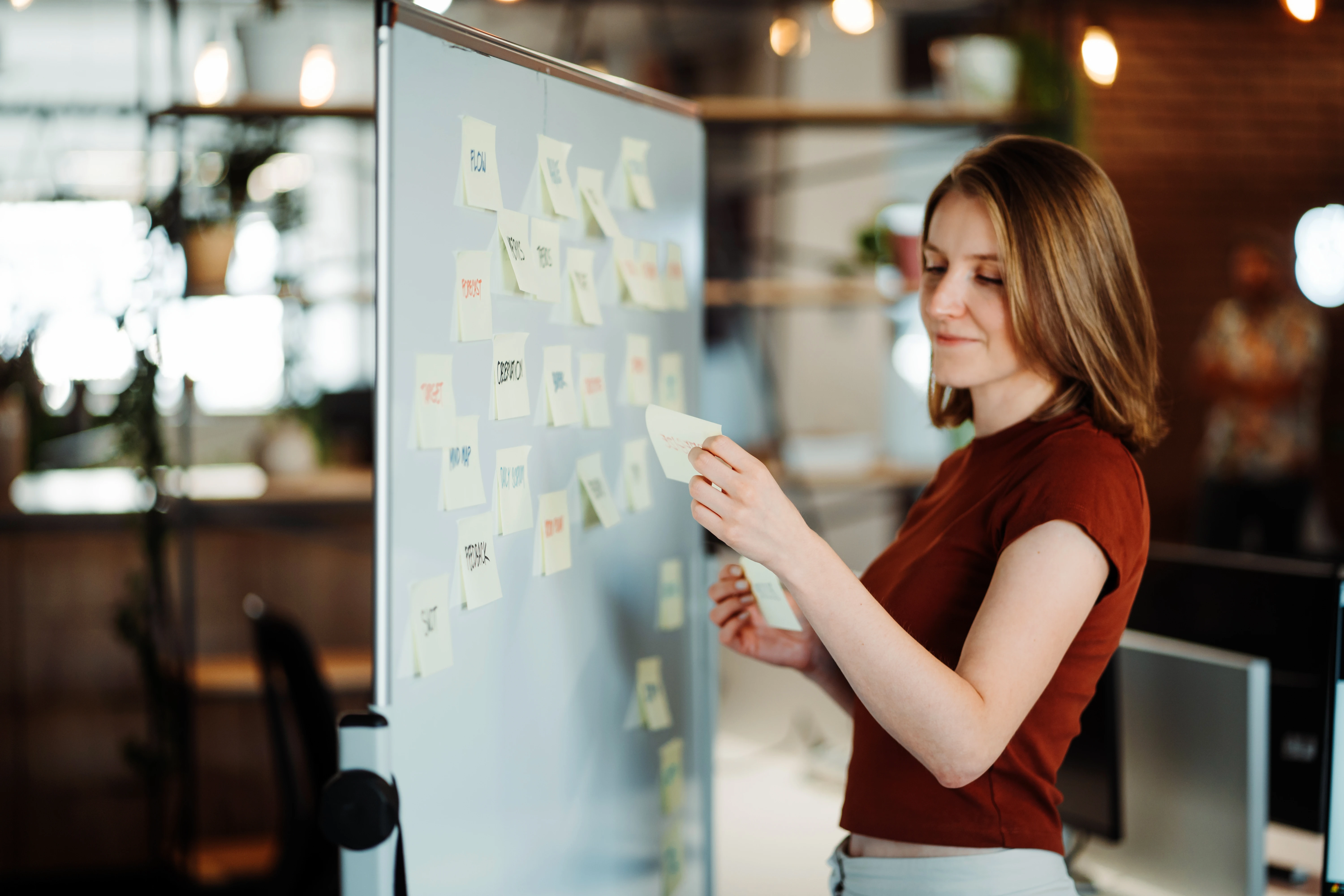 Galeyo team members in a relaxed discussion setting inside a modern glass meeting room